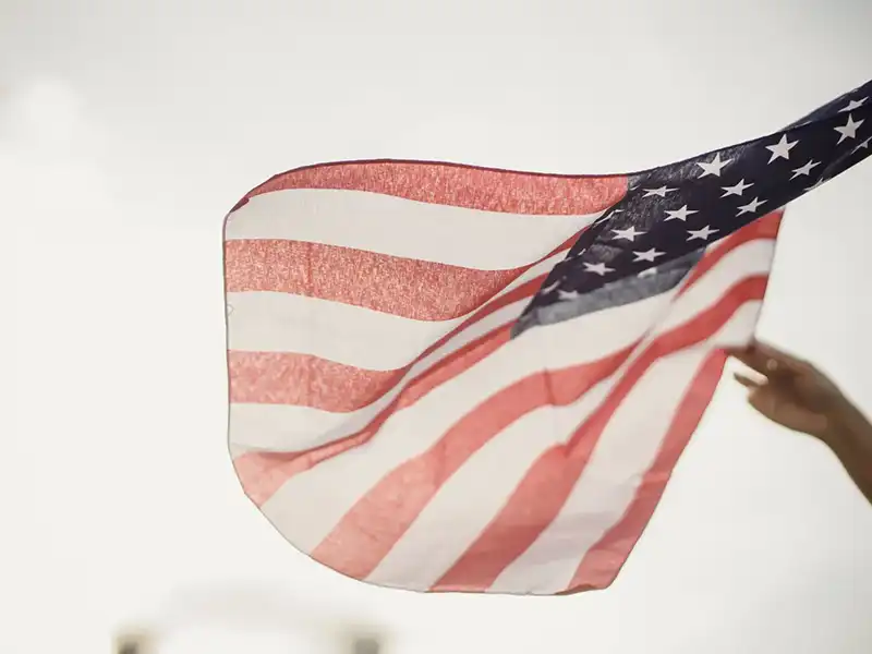 Person waving American flag