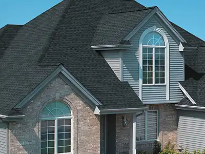 Home with a black shingle roof